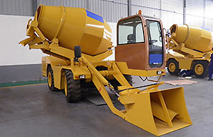 Self-loading mobile concrete mixer